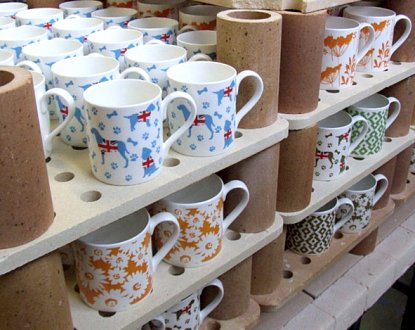 ceramic mugs on shelves